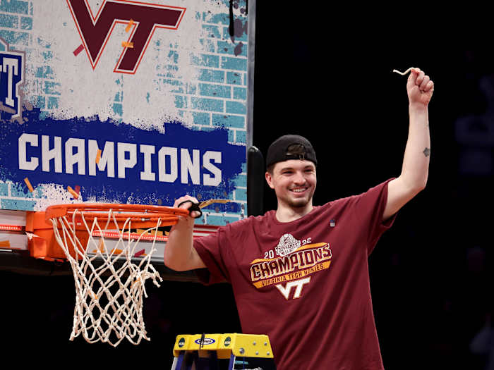 Virginia Tech Hokies guard Hunter Cattoor (0) cuts down the net after defeating the Duke Blue Devils 82-67 in the ACC Men’s Basketball Tournament final at Barclays Center.